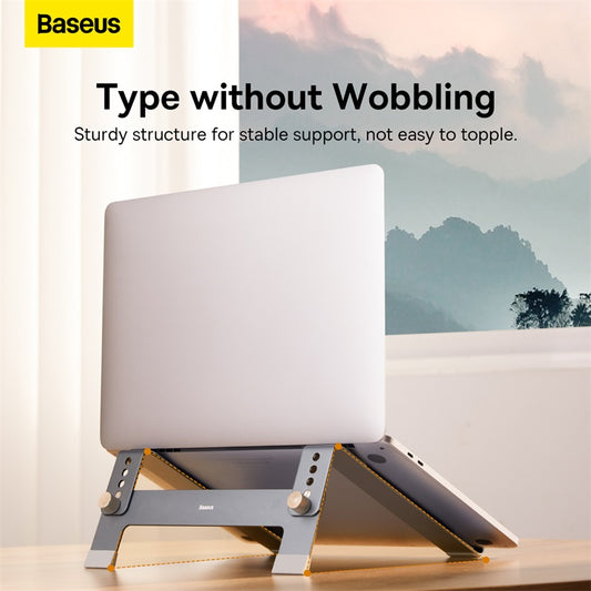 Laptop on a stand with Baseus branding and text about stable support.