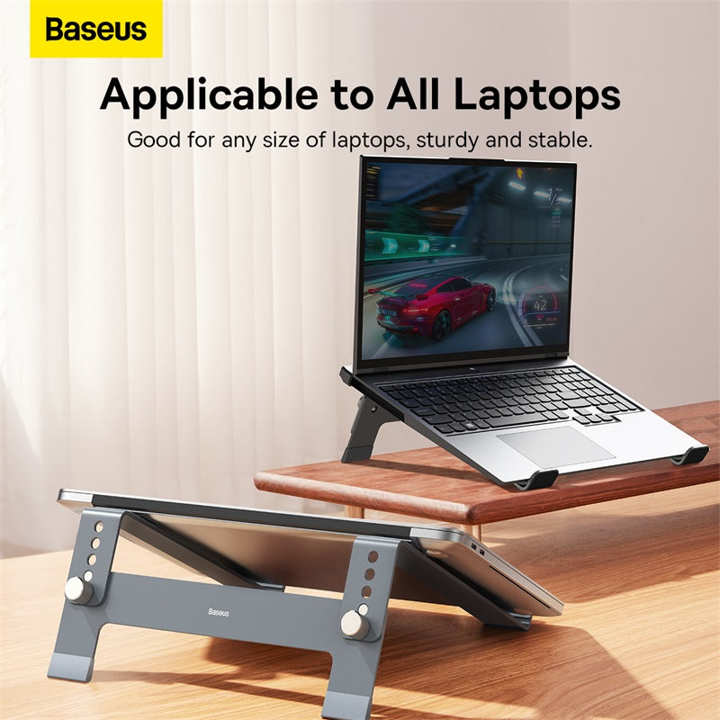 Laptop on a stand with Baseus branding and text about laptop compatibility.
