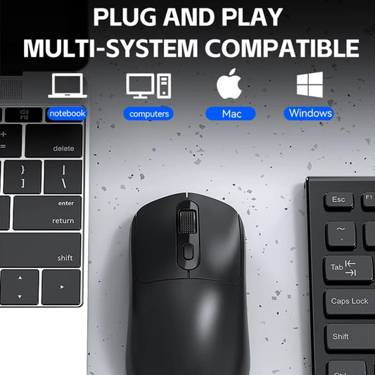 Black mouse on a gray surface with keyboard and text about compatibility with various systems.