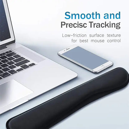 Black wrist pad on a desk with laptop and phone, text about smooth and precise tracking.