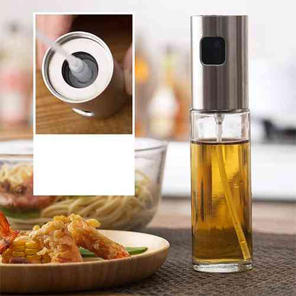 oil spray bottle with the lid open and filled with oil placed in a dinner table