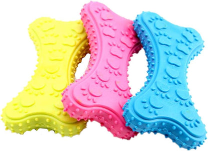 Three colorful dog toys shaped like bones on a white background