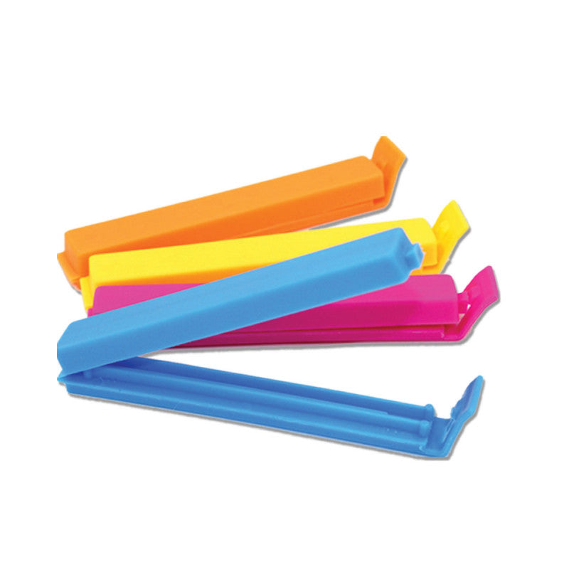 Set of colorful plastic tools on a white background