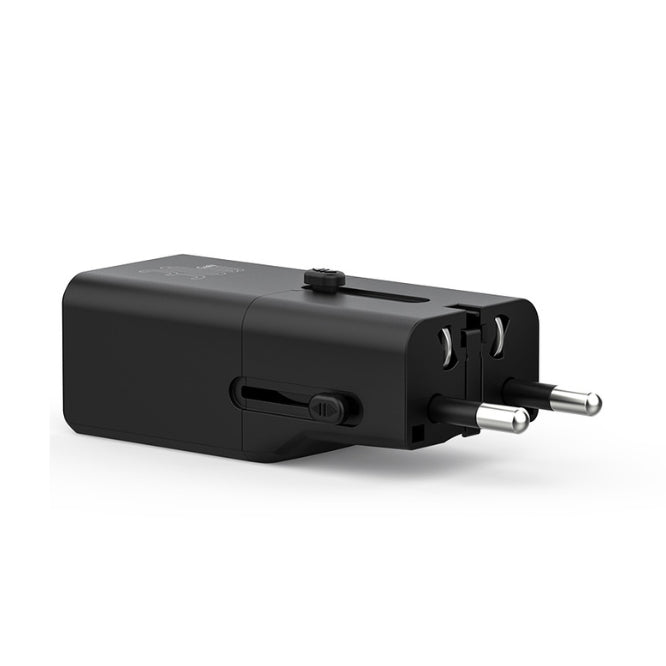 Black travel adapter on a white background