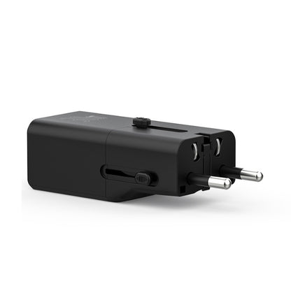 Black travel adapter on a white background