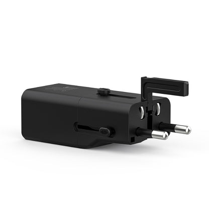 Black travel adapter on a white background