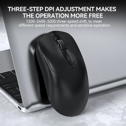 Black computer mouse on a laptop with text about DPI adjustment