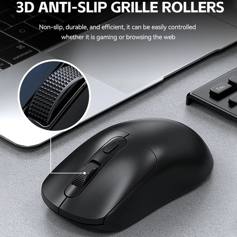 Black computer mouse with 3D anti-slip grille rollers on a desk.