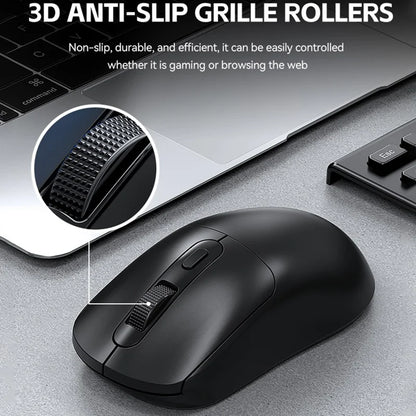 Black computer mouse with 3D anti-slip grille rollers on a desk.