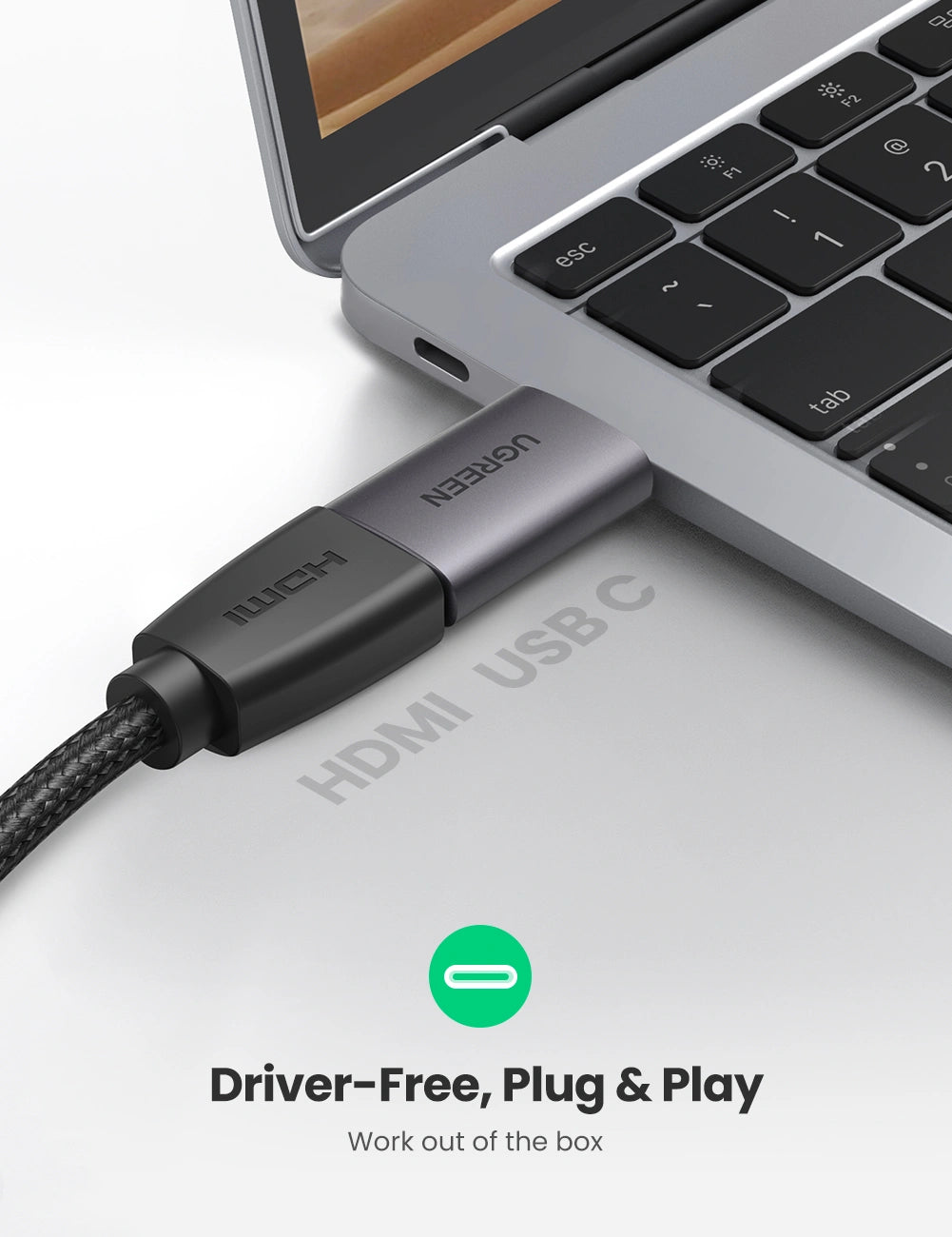 HUB USB-C cable connected to a laptop with 'ugreen' branding on a light gray background.